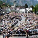 Citizens voting by show of hands at the Landsgemeinde in Glarus, Switzerland