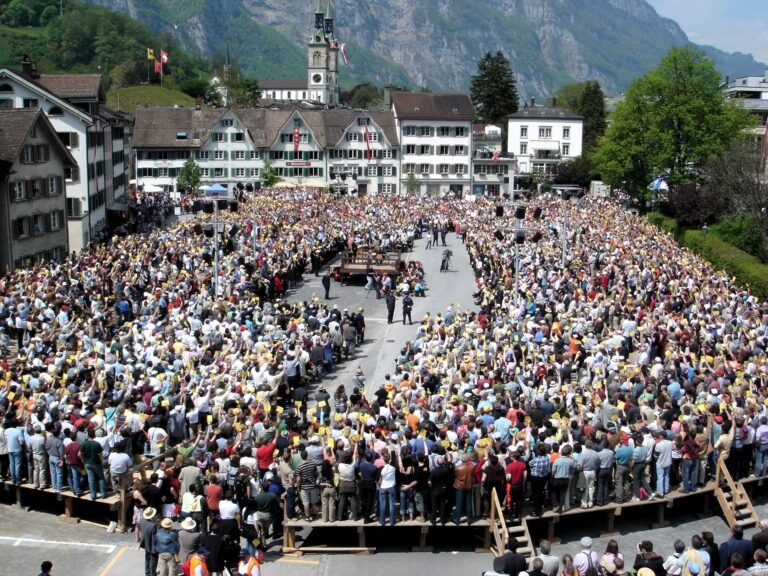 Citizens voting by show of hands at the Landsgemeinde in Glarus, Switzerland