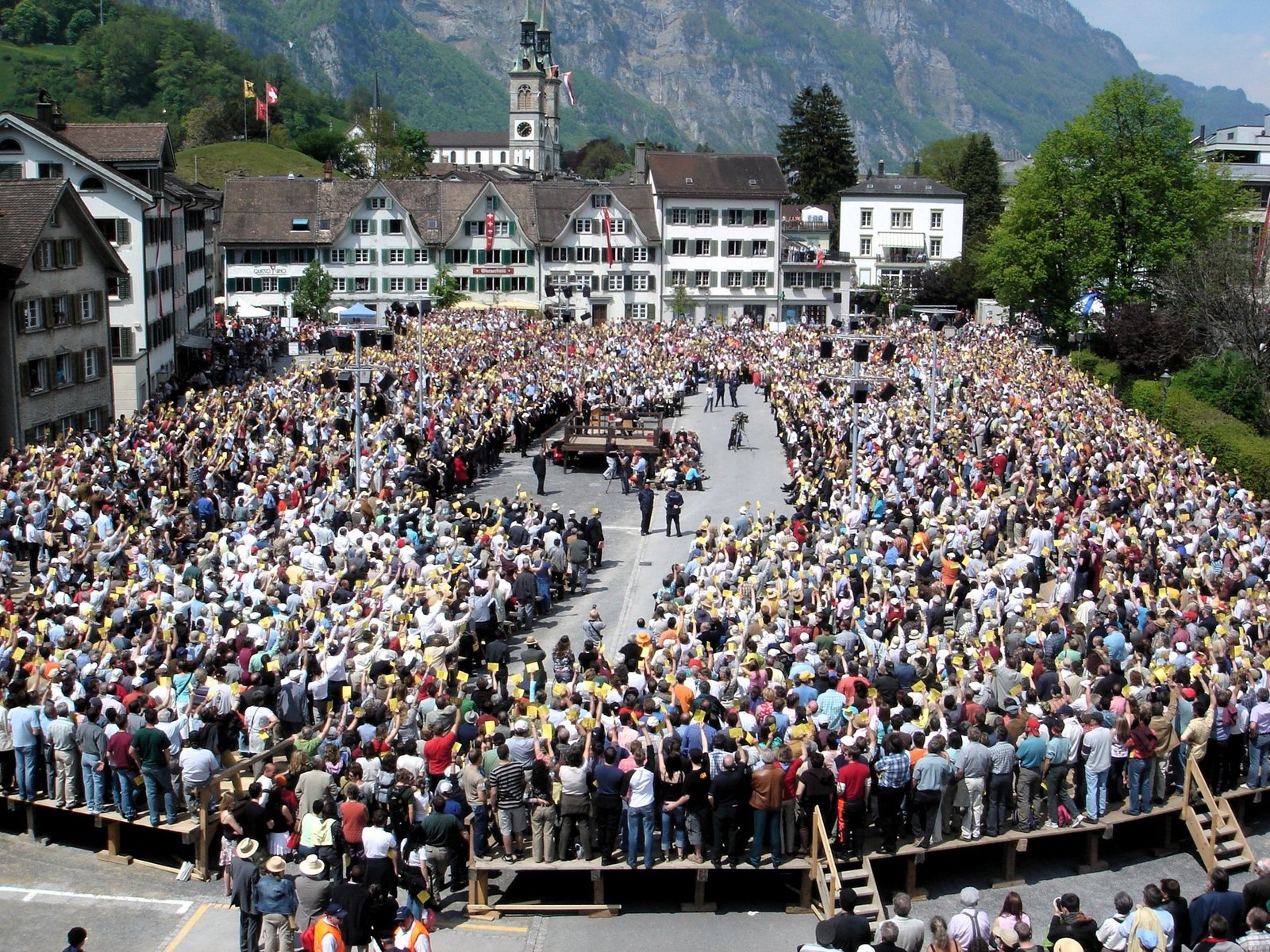 Citizens voting by show of hands at the Landsgemeinde in Glarus, Switzerland